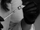 medical professional preparing injection in clinic