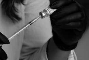 medical professional preparing injection in clinic